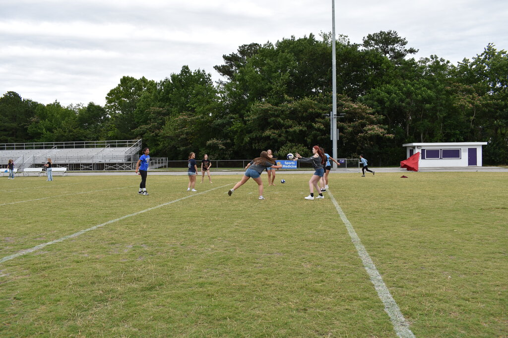 Playing volleyball at field day