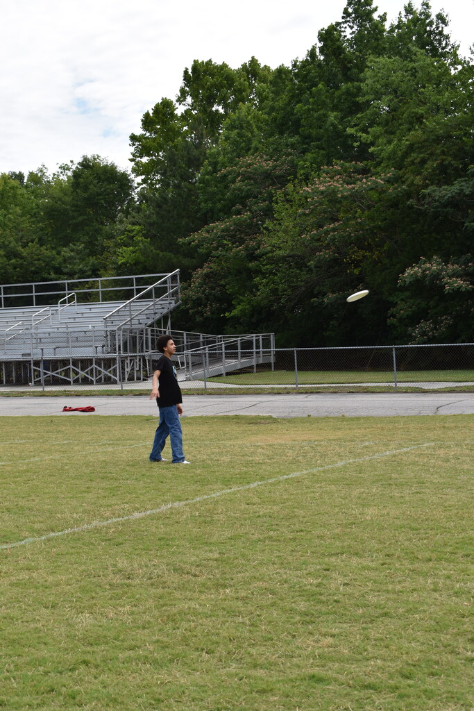 Throwing a frisbee at field day