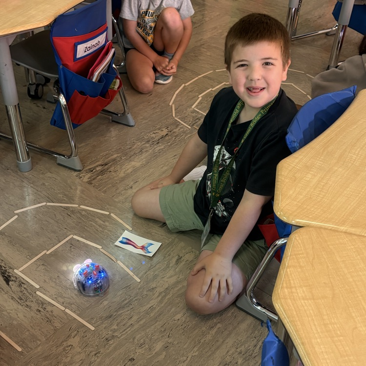 student with a beebot max