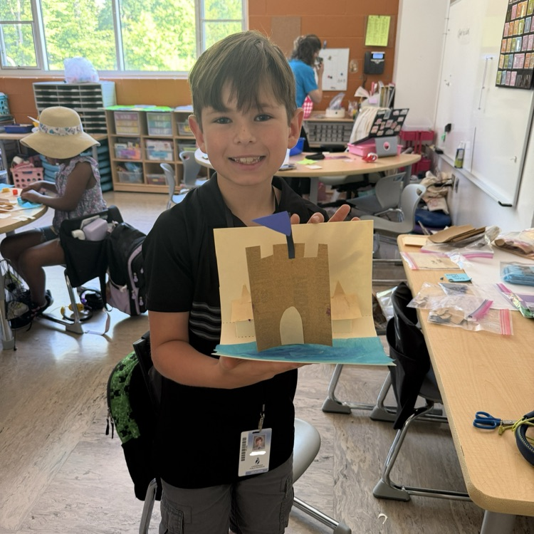 student with 3D sandcastle 