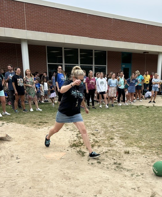 teacher kicking the ball
