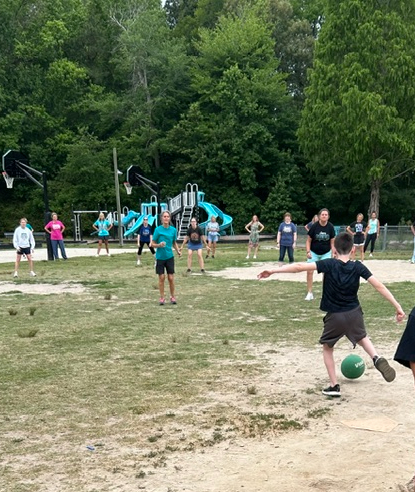 student kicking the ball