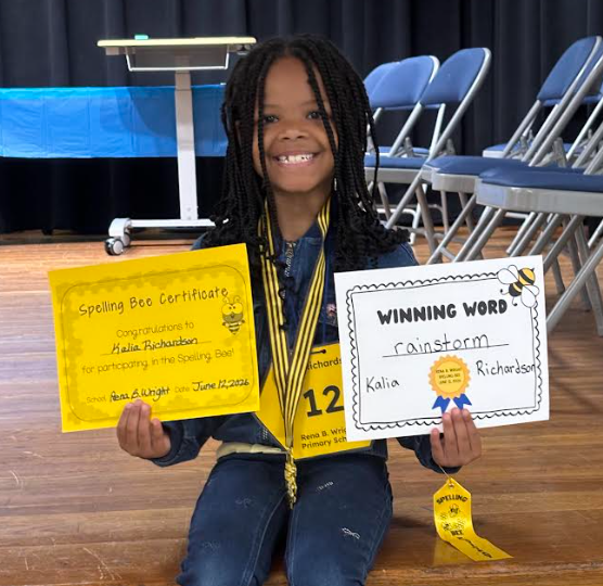 Kalia with her winning certificates