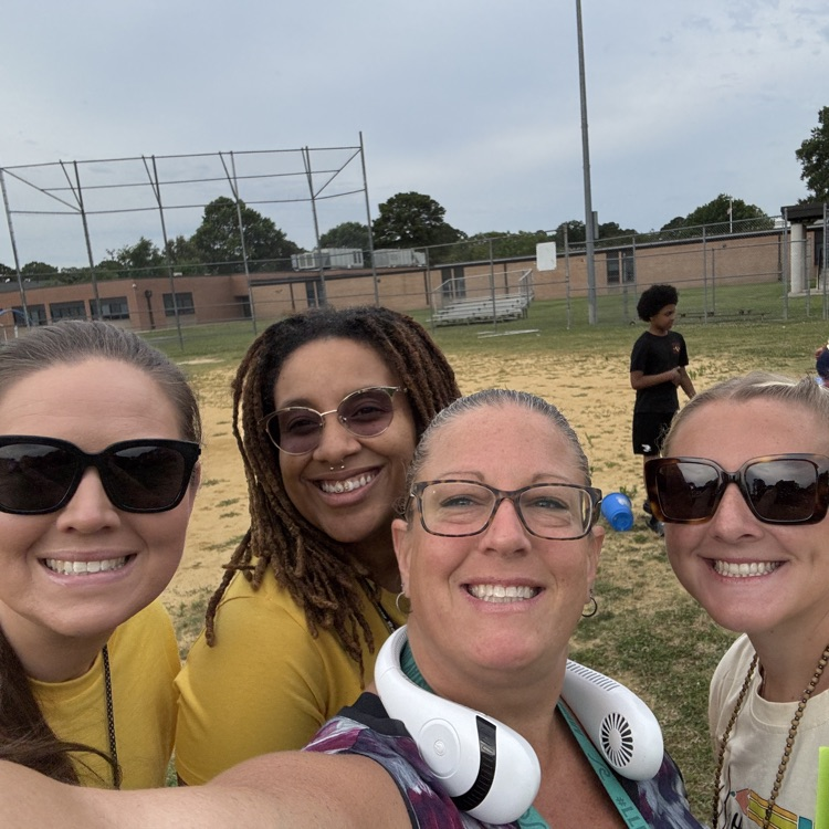 Selfie time with smiling teachers at field day. 