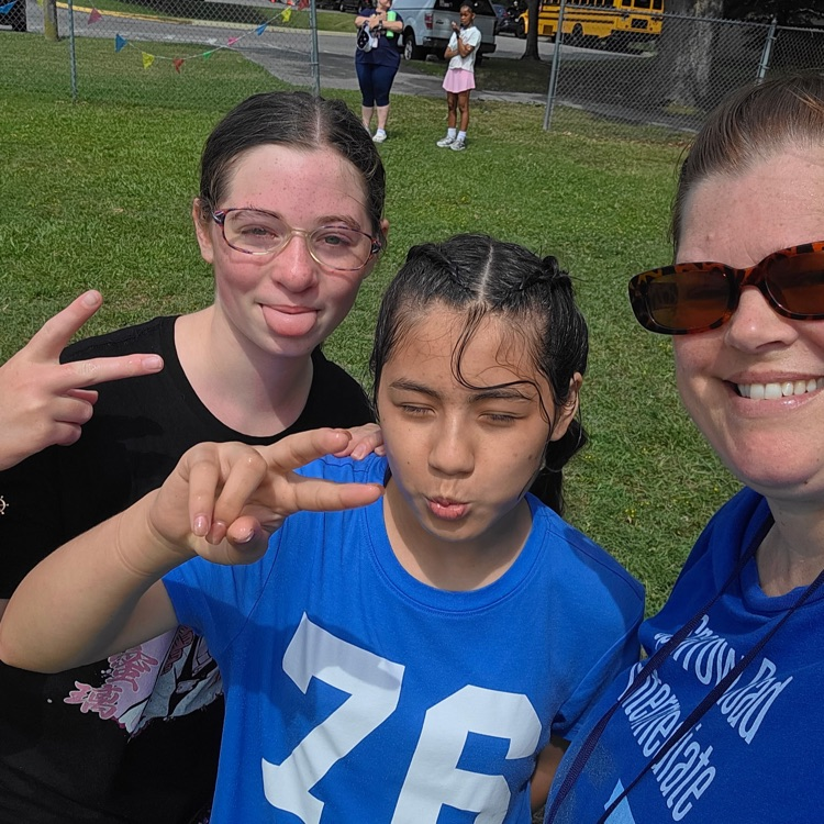 Selfie with two students and Mrs. Shaughnessy outside at field day. 