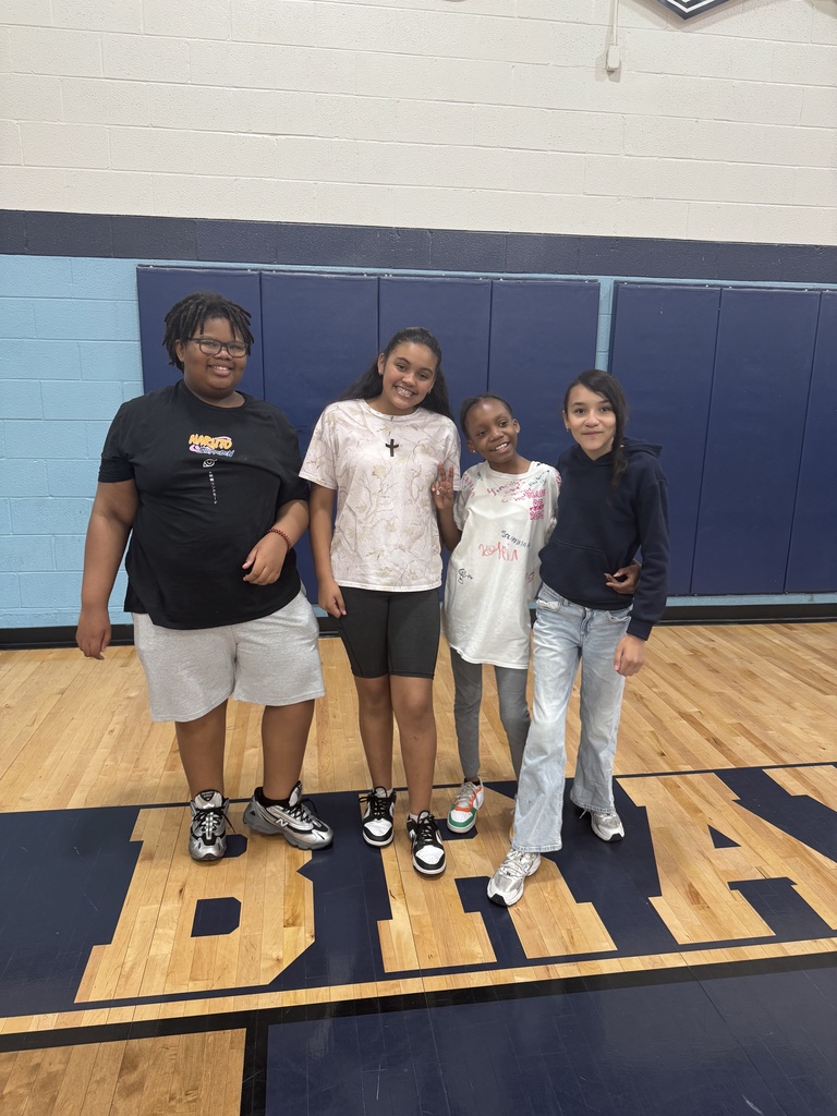 Students standing together during field day inside