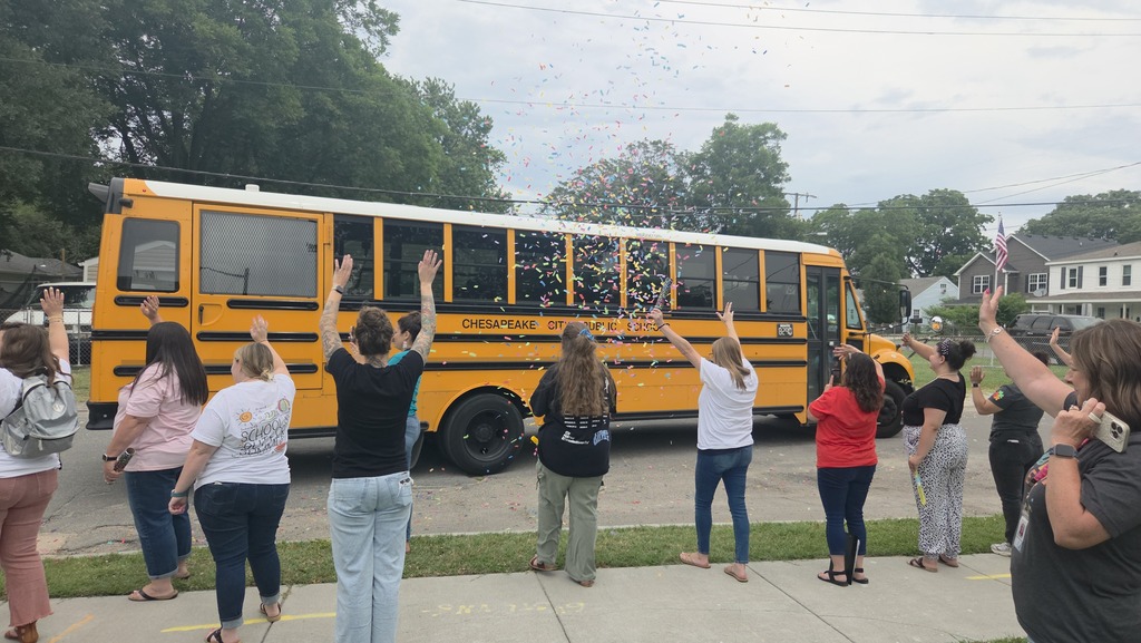 Teachers waving goodbye to the students