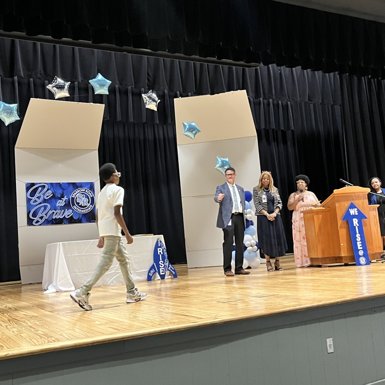 Ms. Smith’s student walking across the stage. 