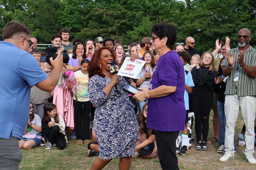 Teacher being interviewed by a news reporter