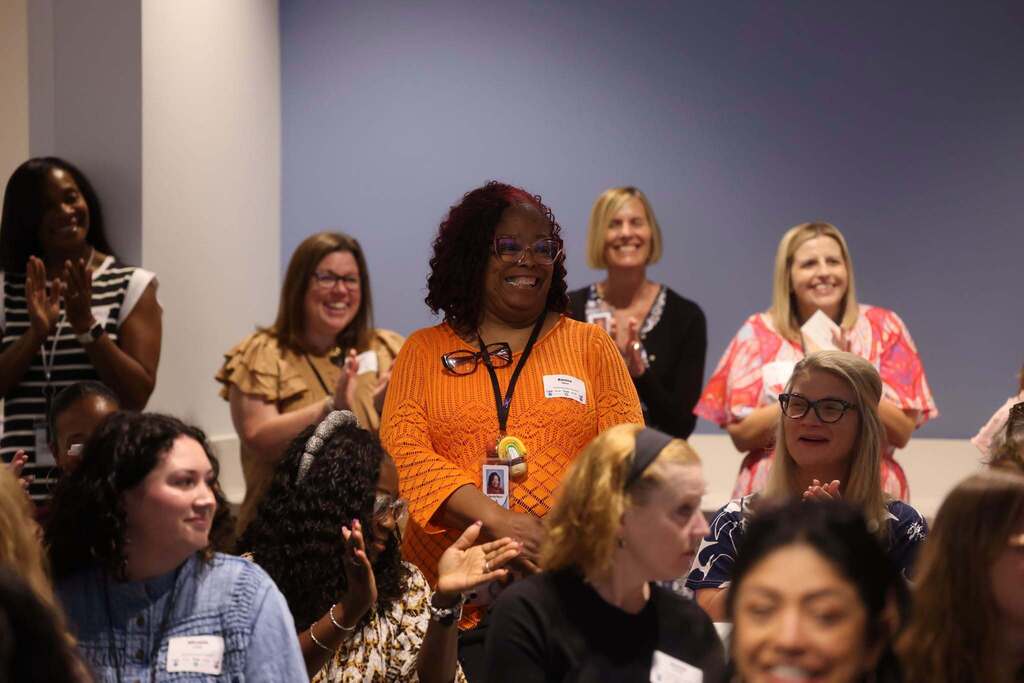 An educator being recognized by her peers.