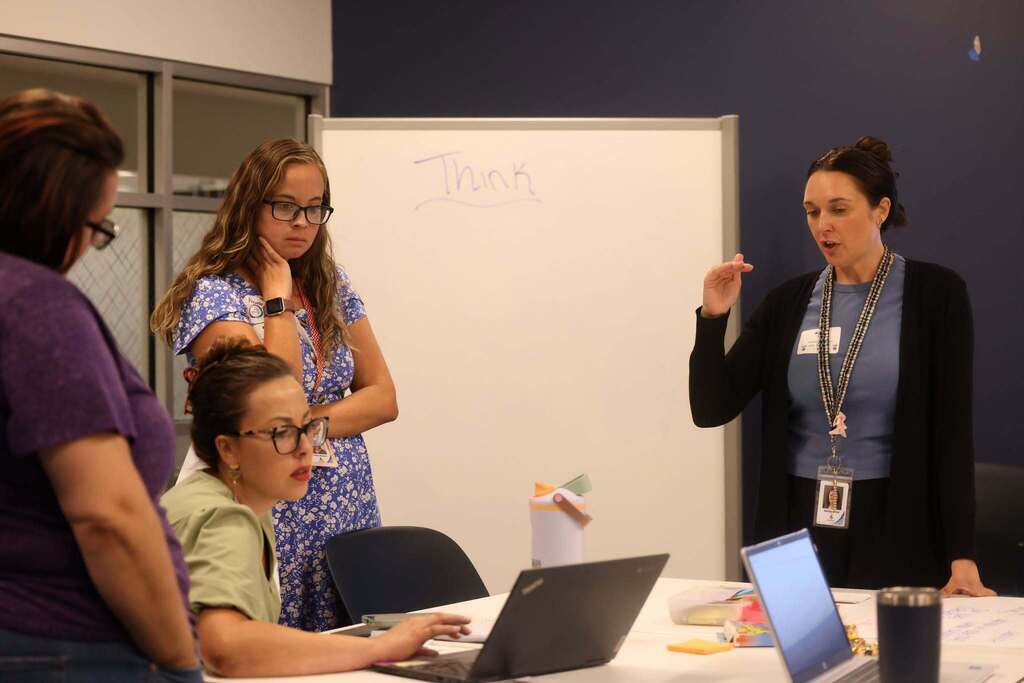 A working session at the conference with educators learning together.