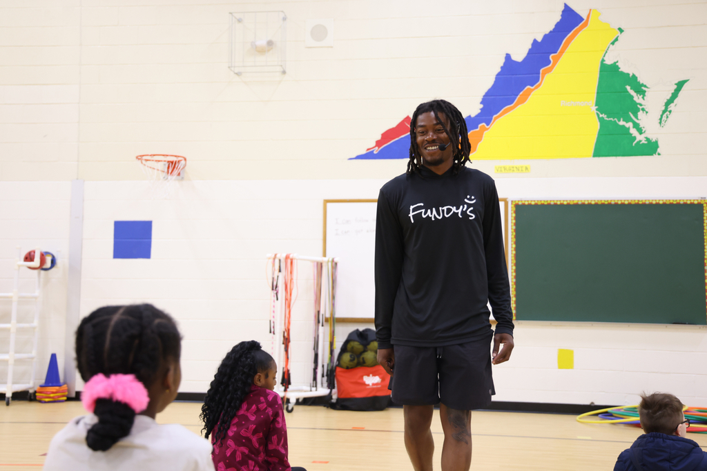 Perry Hunt smiling at his students.