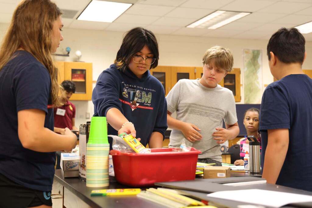 students gather supplies for project