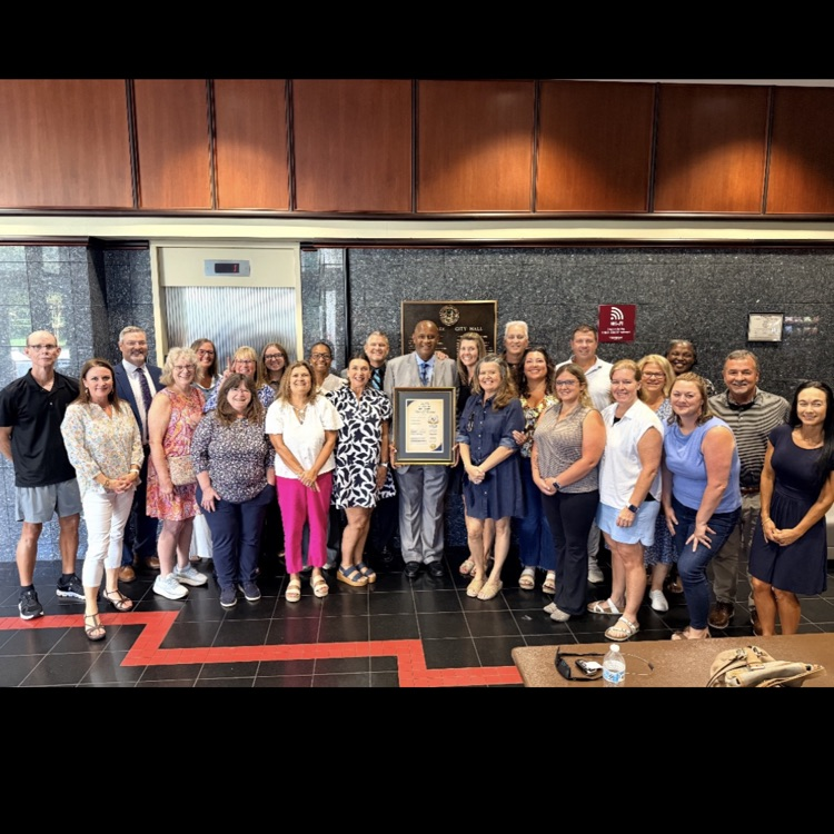 HMS staff standing with the honoree
