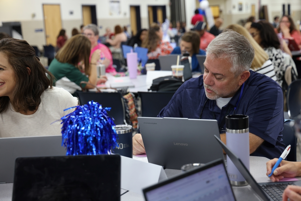 Principal working with their team. 