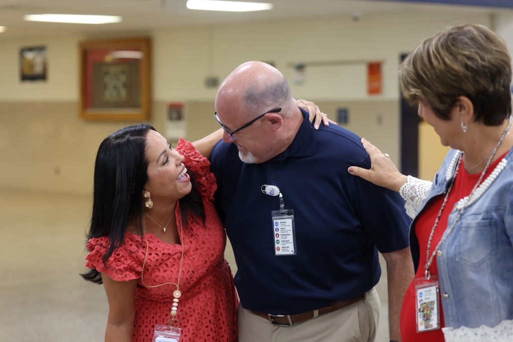 School leaders happy to see each other. 