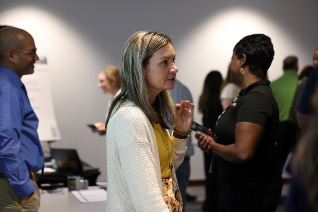 CPS Employees converse with outside vendors at the Job vendor fair