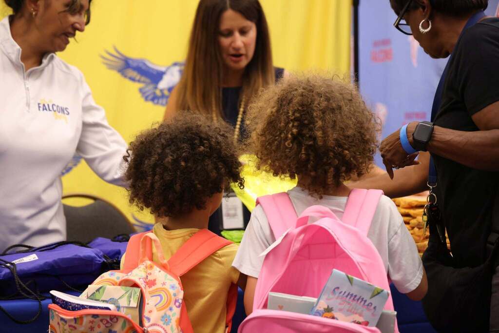 students gather free items at Get on the Bus