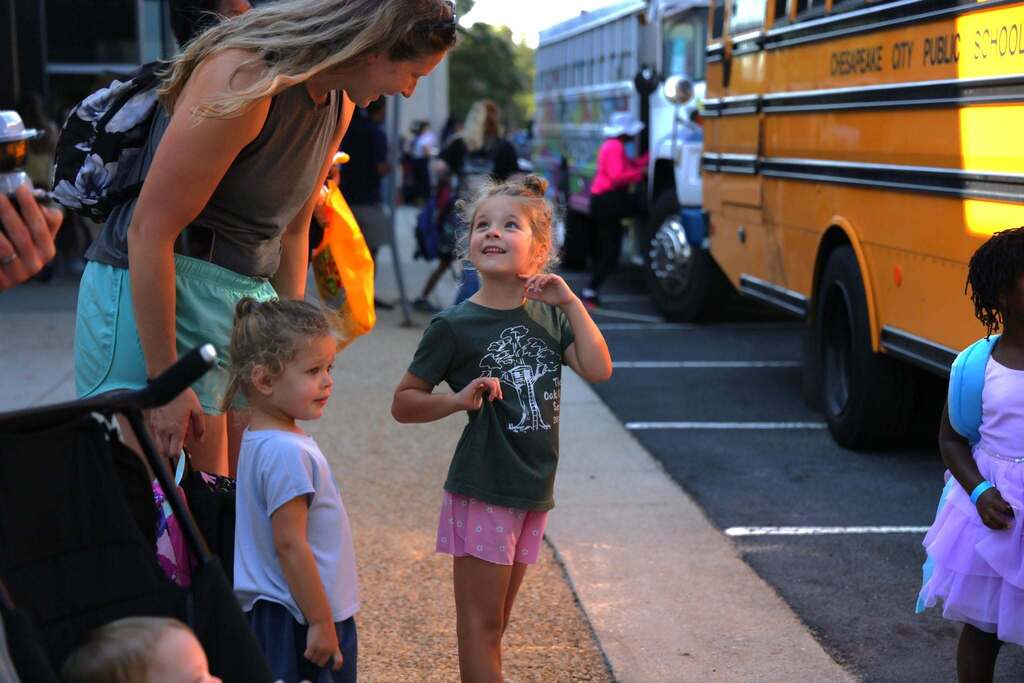 families prepare to load onto bus