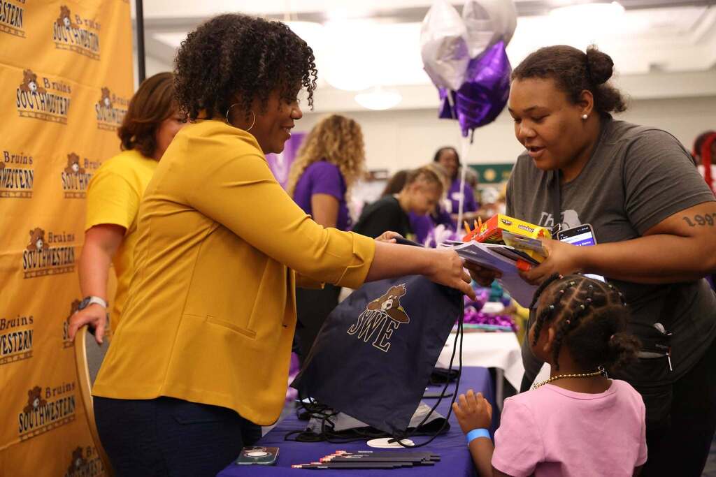 Families receive free school supplies at event