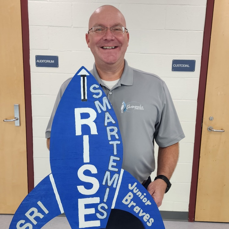 More staff smiling and holding Smartemis rocket cutout. 