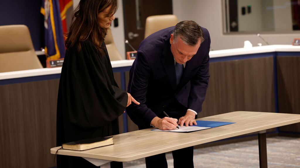 Dr. Brubaker signs the certification of his oath.