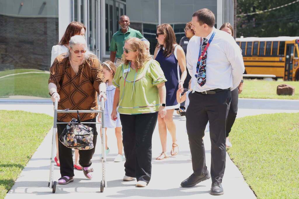 Ms. Chittum walks for tour of school