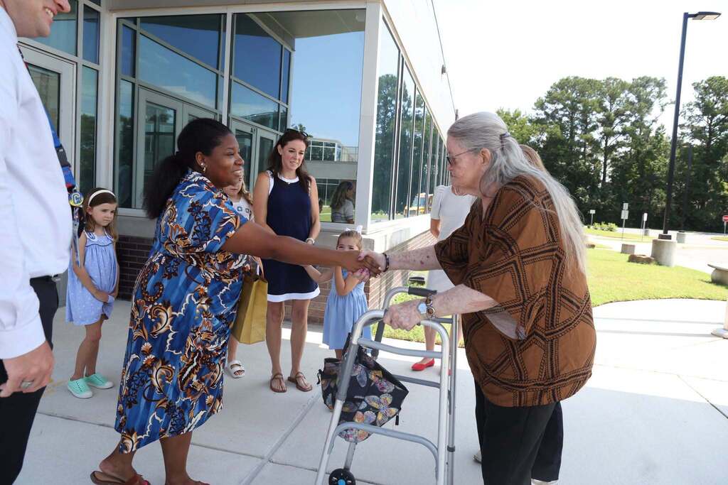 Ms. Chittum happily greets Assistant principal
