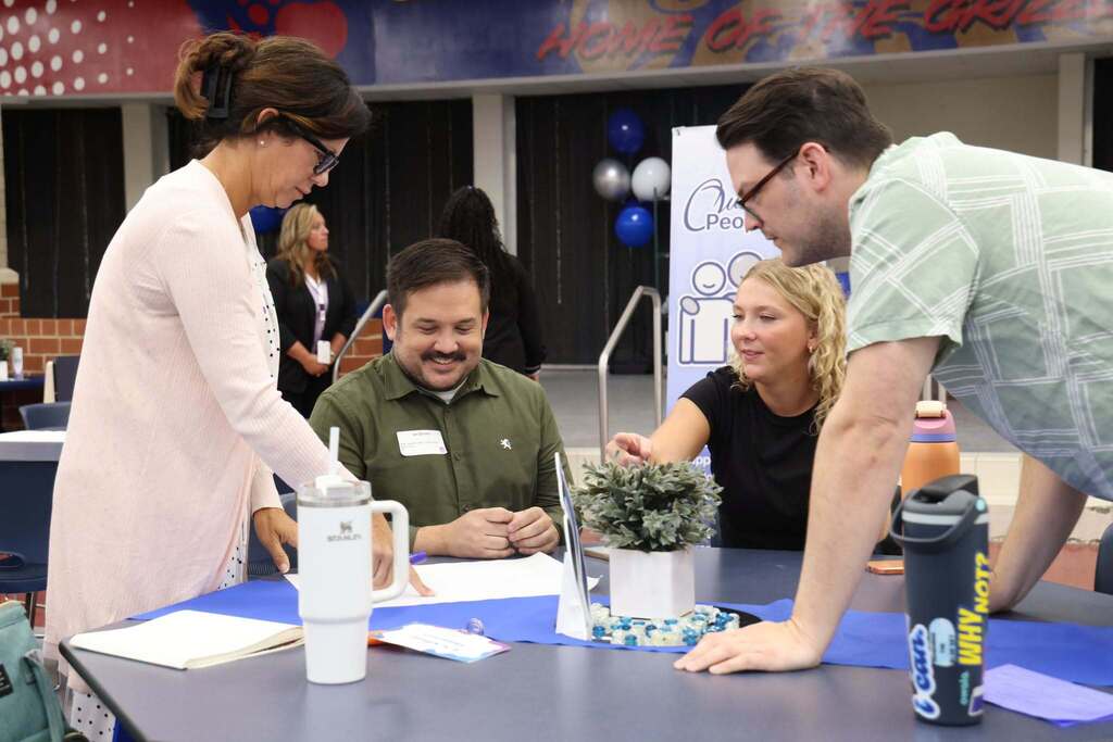 new teachers collaborate intently