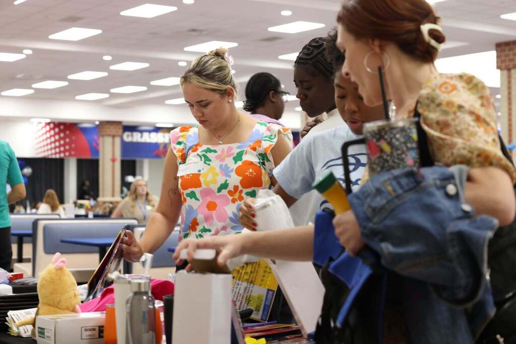 teachers look through supplies