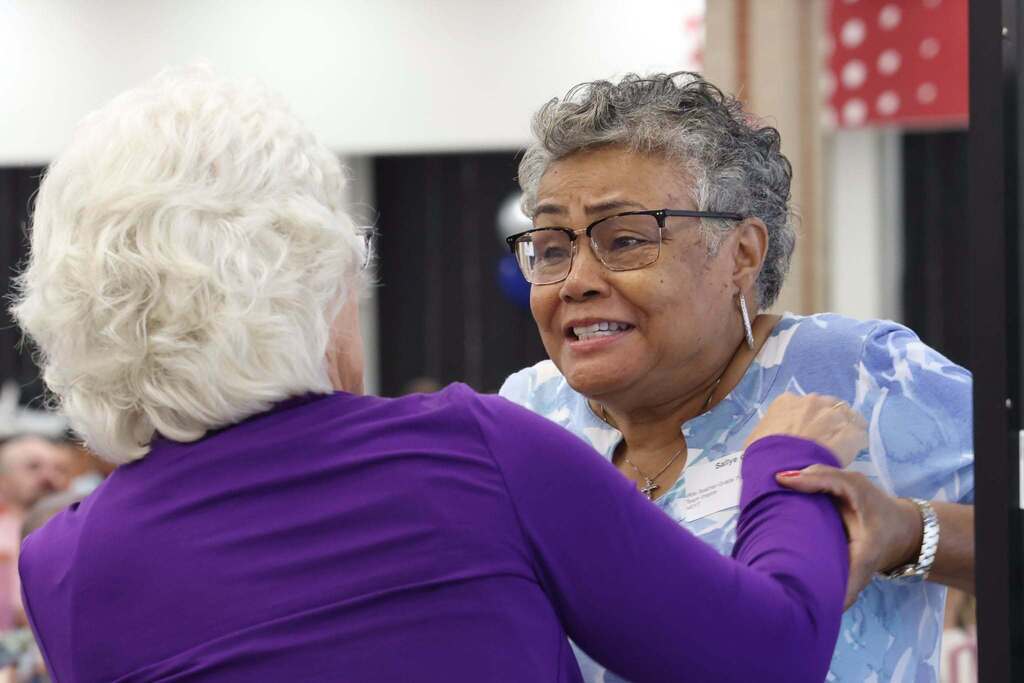 teachers greet each other with excitement