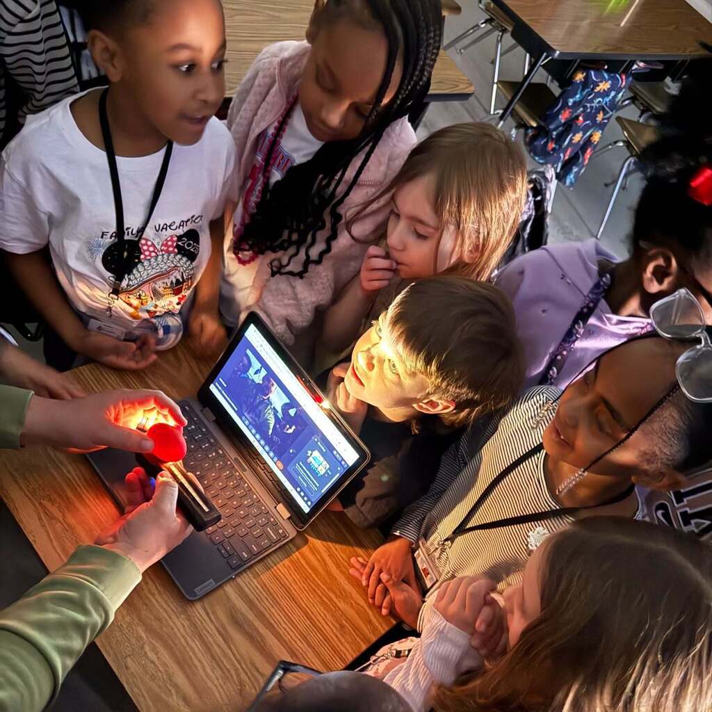 students gather to learn about hatching eggs