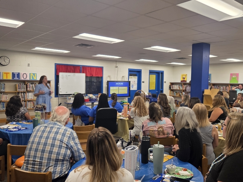 Staff listening to presentations my admin
