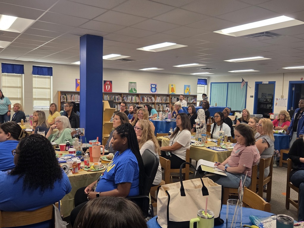 Staff listening to presentations.