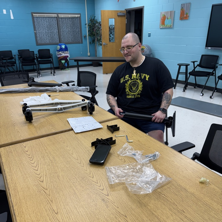 military volunteer putting together a table