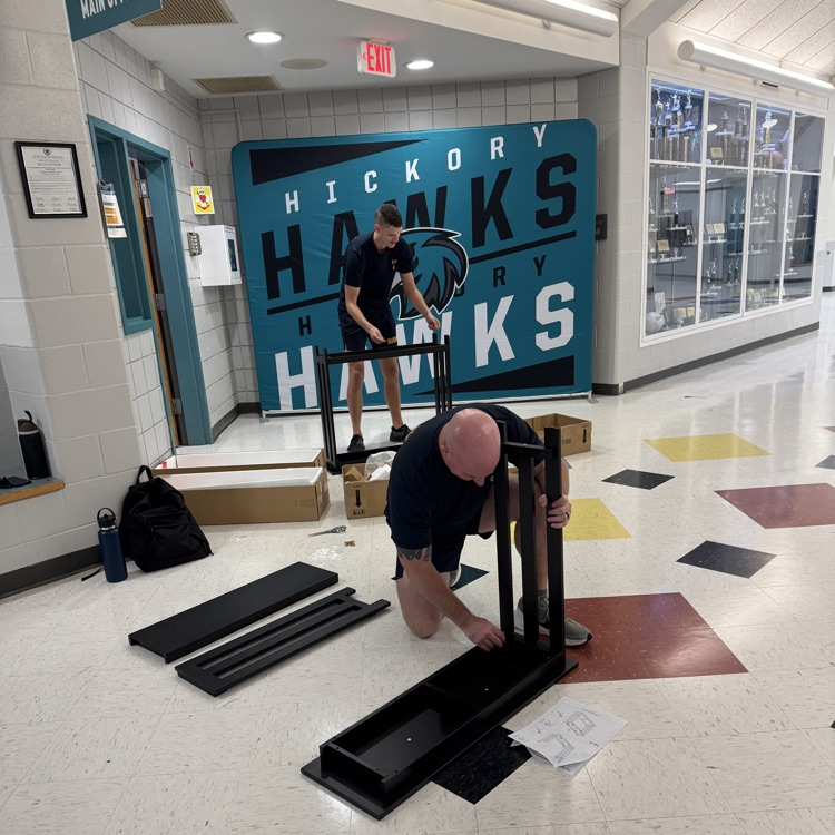 military volunteers putting tables together