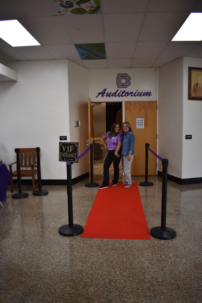 Teacher walking the red carpet