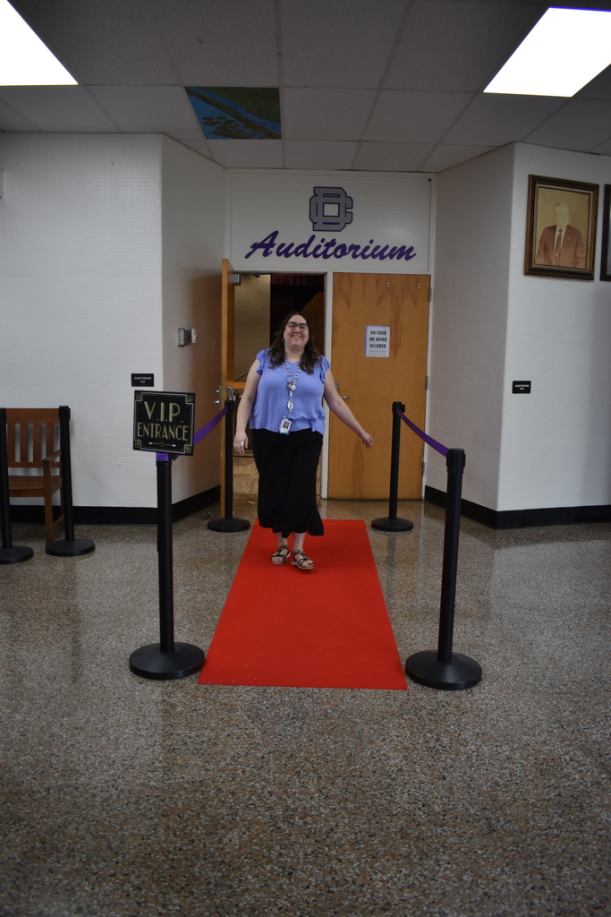 Teacher walking the red carpet