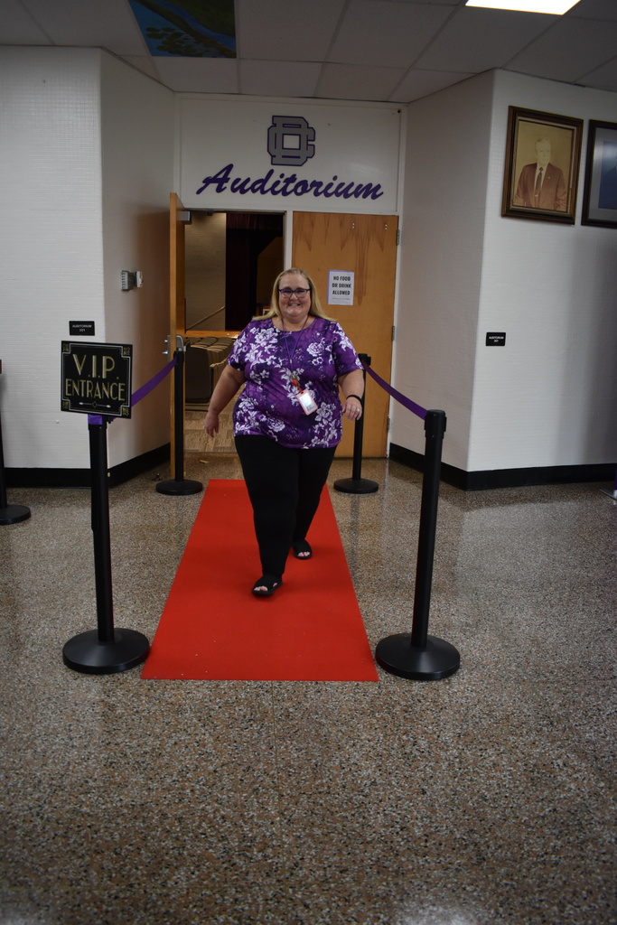Teacher walking the red carpet