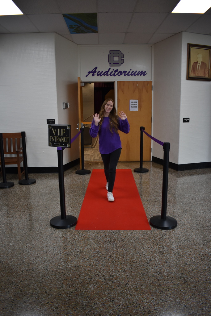 Teacher walking the red carpet