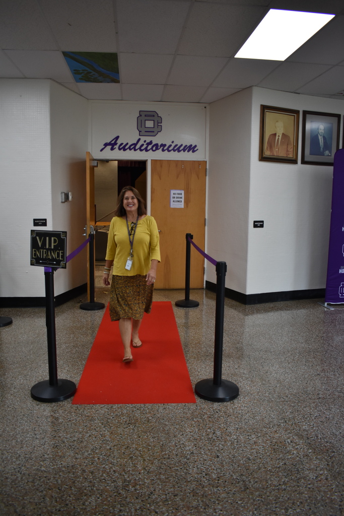 Teacher walking the red carpet