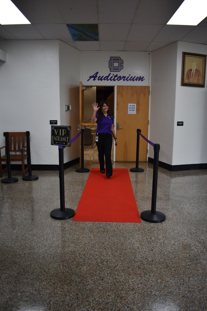 Teacher walking the red carpet