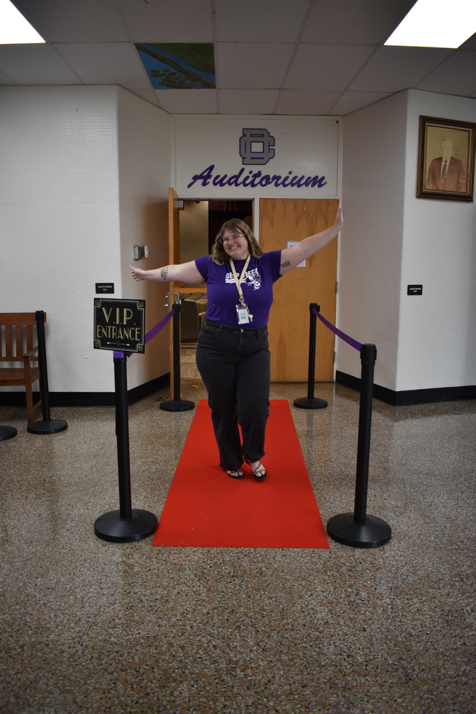 Teacher walking the red carpet