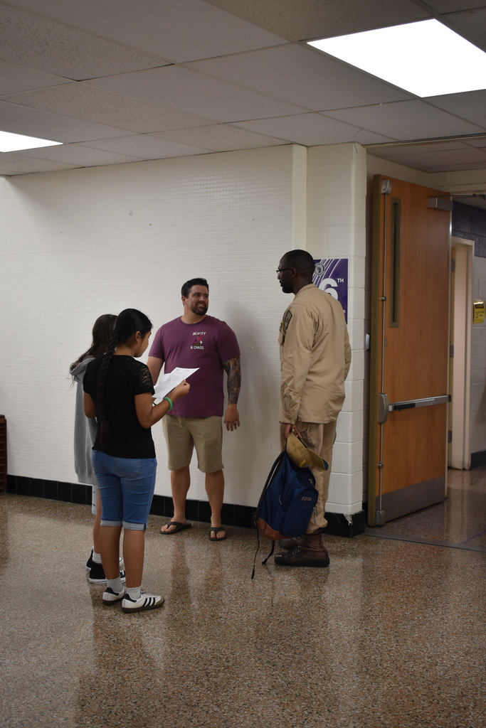 Families arriving to open house
