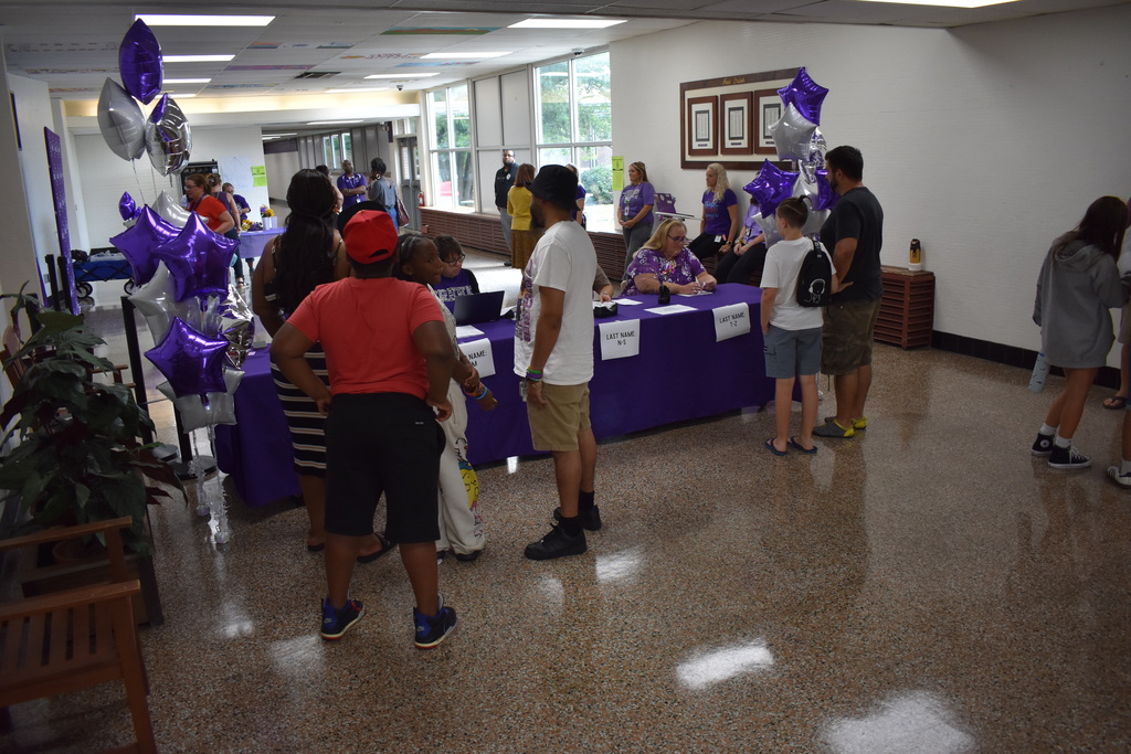 Families arriving to open house
