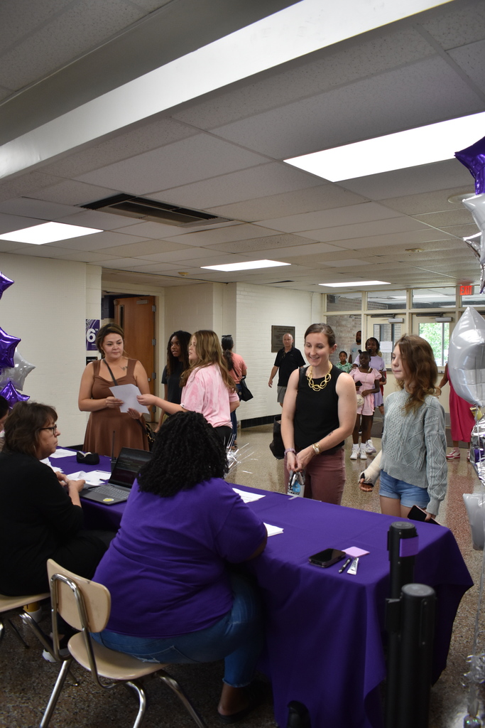 Families arriving to open house