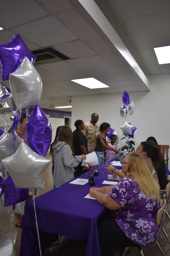 Families arriving to open house