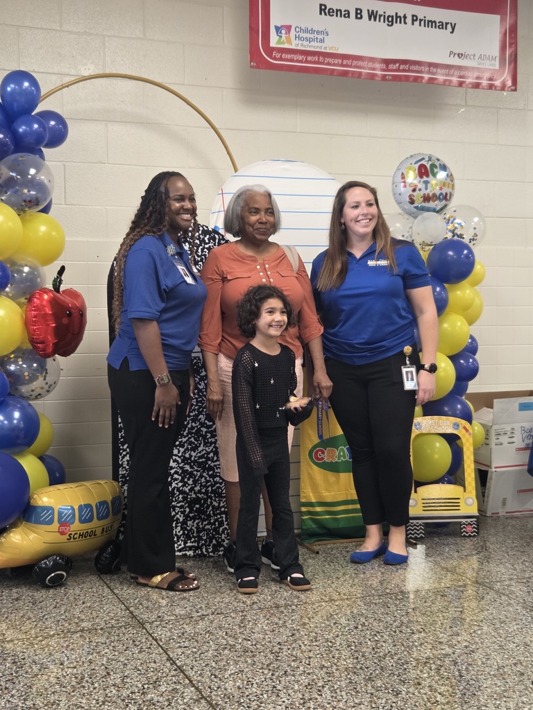 Admin with family at back to school backdrop