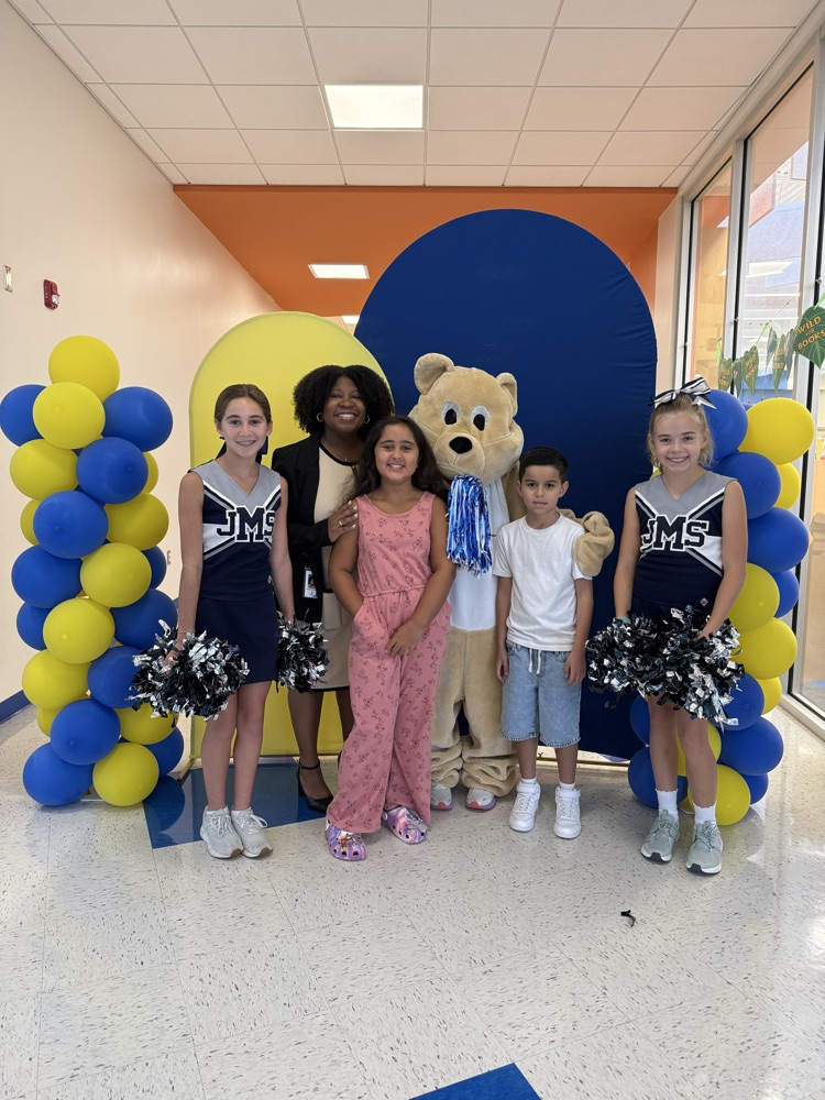 assistant principal, standing with students during meet and greet