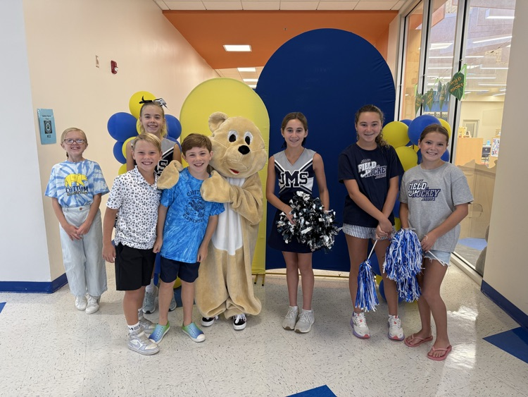 students smiling for the camera at meet and greet